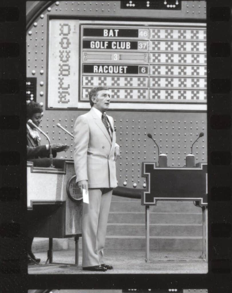 Host looking off from stage