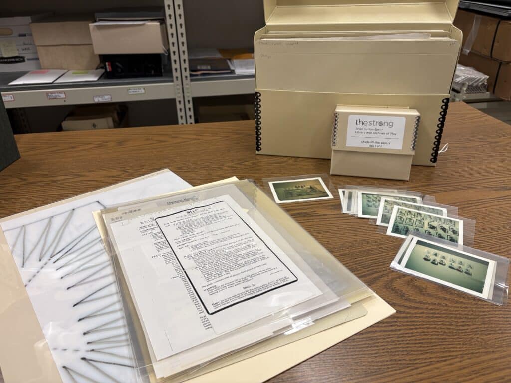 Charles Phillips Papers - Born in Jamica and a graduate of Howard University, after college he began to work for to car manufacturing and later shifted into game and toy design. The material consists of game design documents, game rules, game board drafts, game component and packaging proofs, correspondence, photographs, and drawings. Gift of Eleanor Giannelli in memory of Charles Phillips. The Brian Sutton-Smith Library and Archives of Play at The Strong, Rochester, New York.