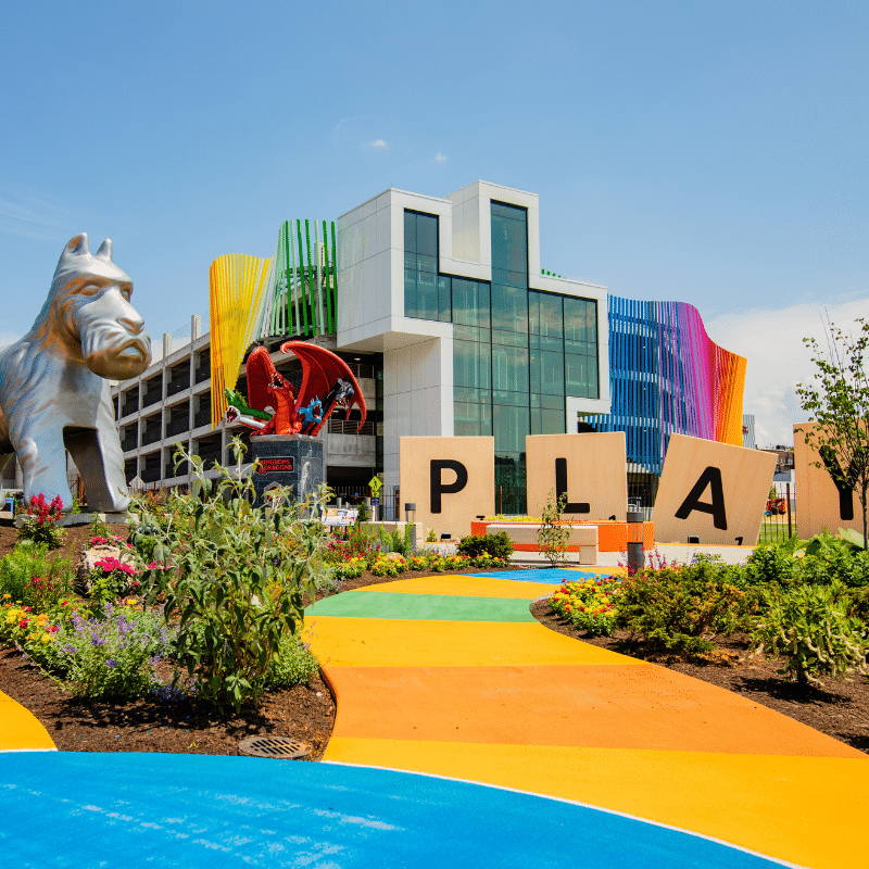 Giant Scottie Dog Monopoly piece and giant Scrabble tiles spelling "PLAY"