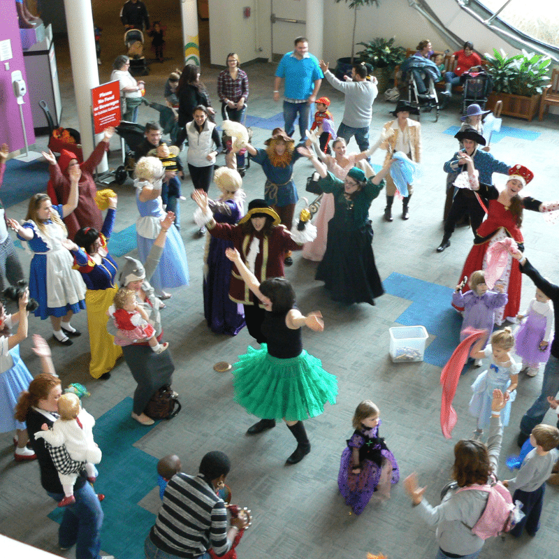 Large Group of people dancing in the Adams Atrium