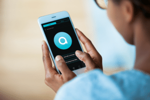 Image of hands holding phone with AIRA app on screen