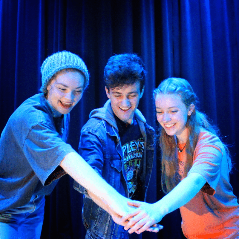 Three "Lightning Thief" actors huddled together